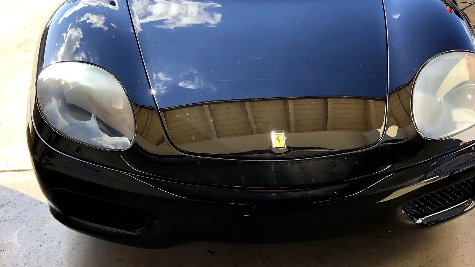 Smog retest in Escondido, CA: black sports car in our bay