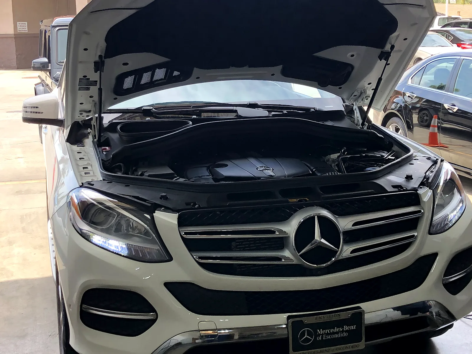 STAR smog check in Escondido, CA: Mercedes-Benz SUV with the hood open